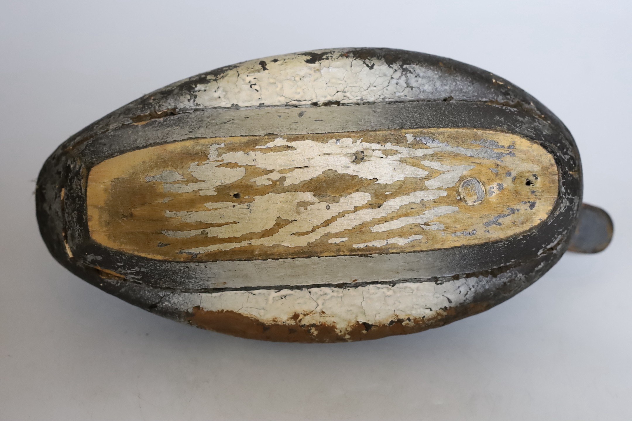 A 19th century painted decoy duck. 33cm long